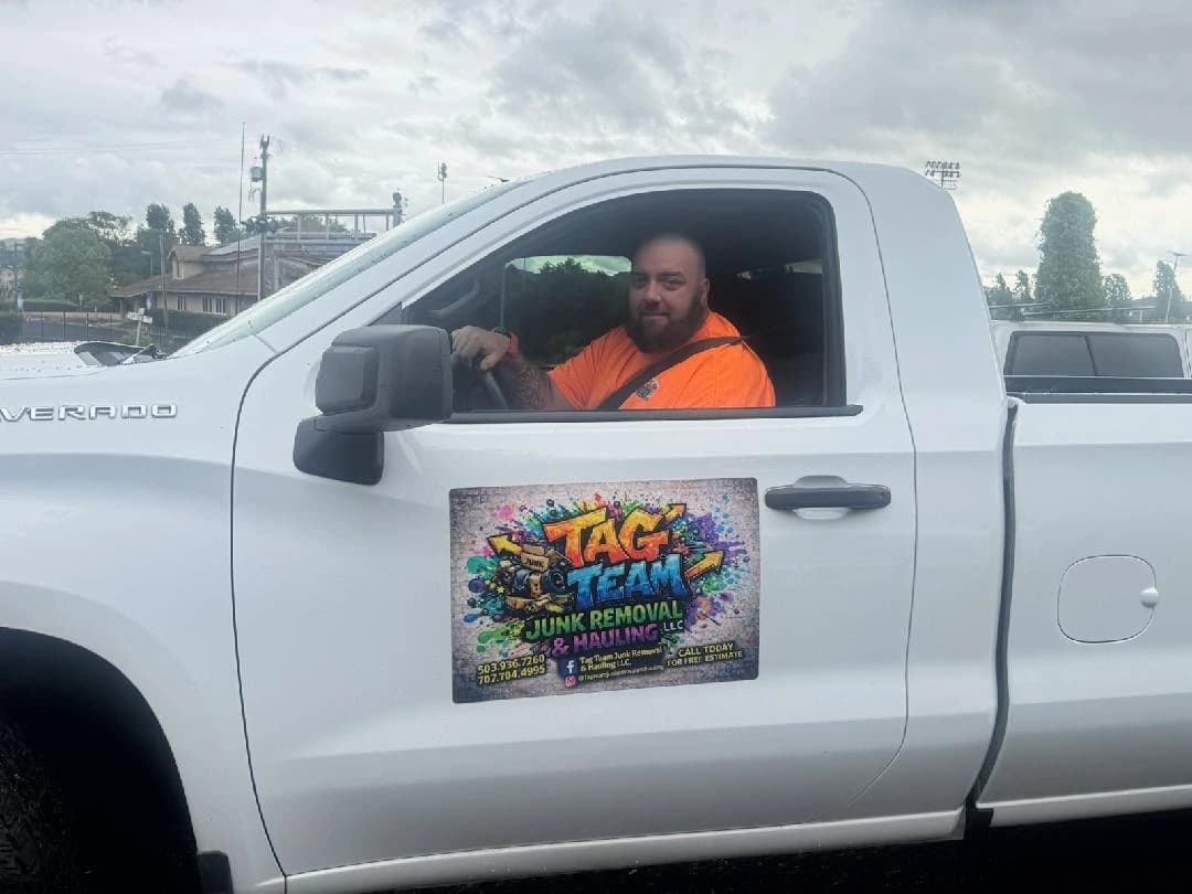 Tag Team Junk Removal crew and branded truck serving the local community