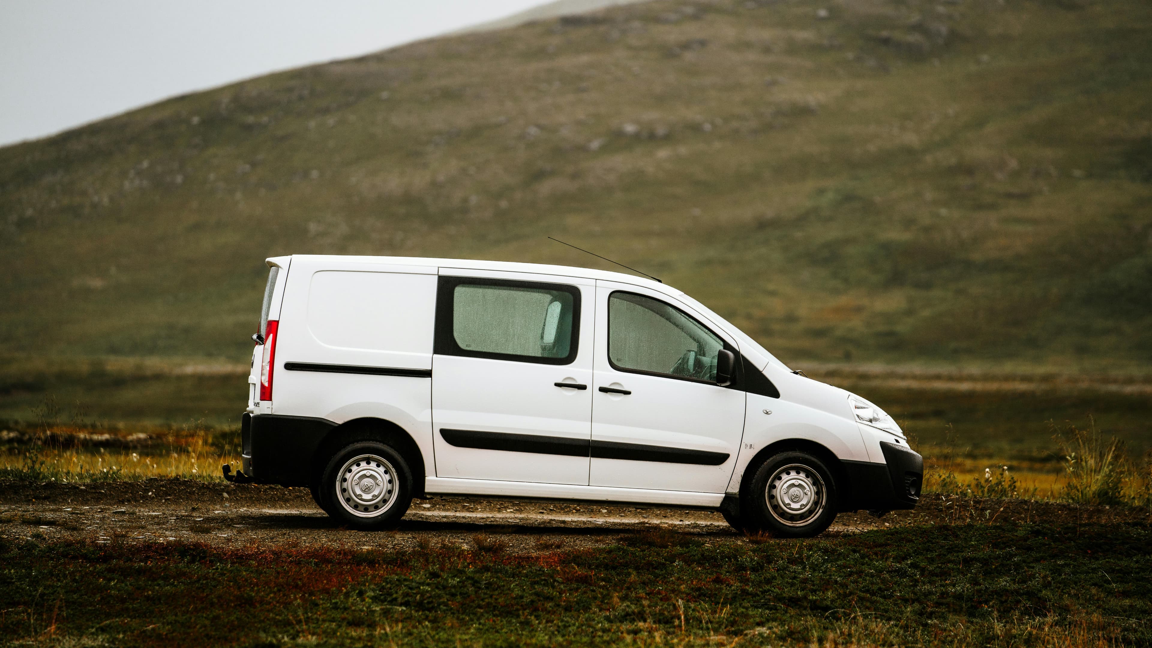 White cargo van for professional junk pickup and hauling